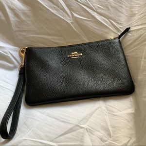 Black Coach wristlet with gold hardware